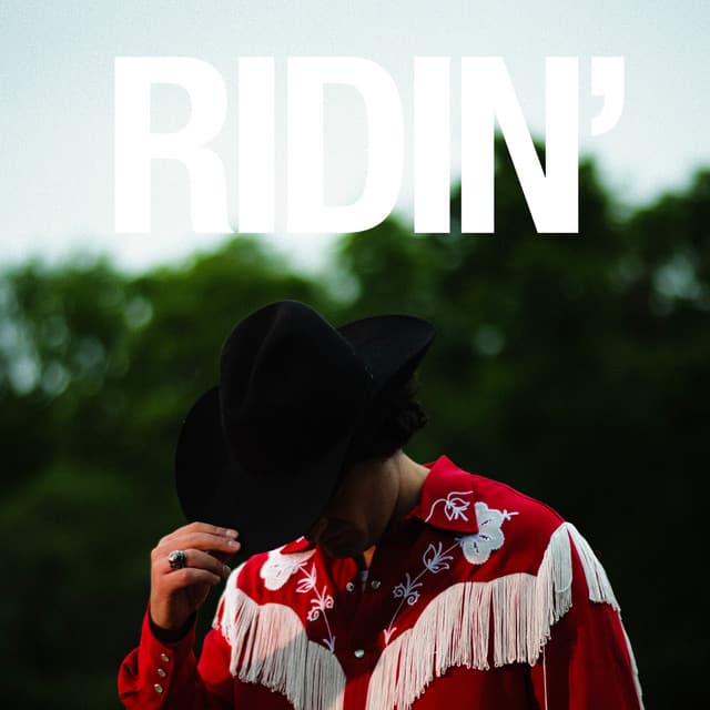 Cover of Ridin’: Joey Myron tipping a black hat in a red fringe shirt